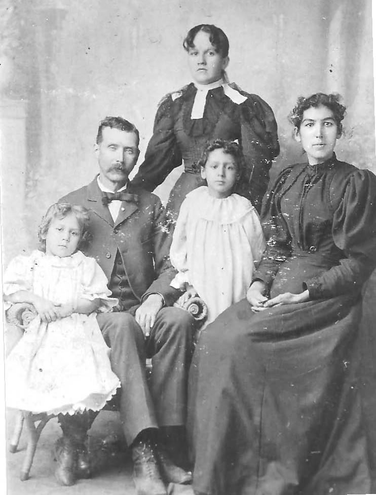 Jacob Owen Rutledge, his wife and two daughters with wife's cousin (standing) c. 1896